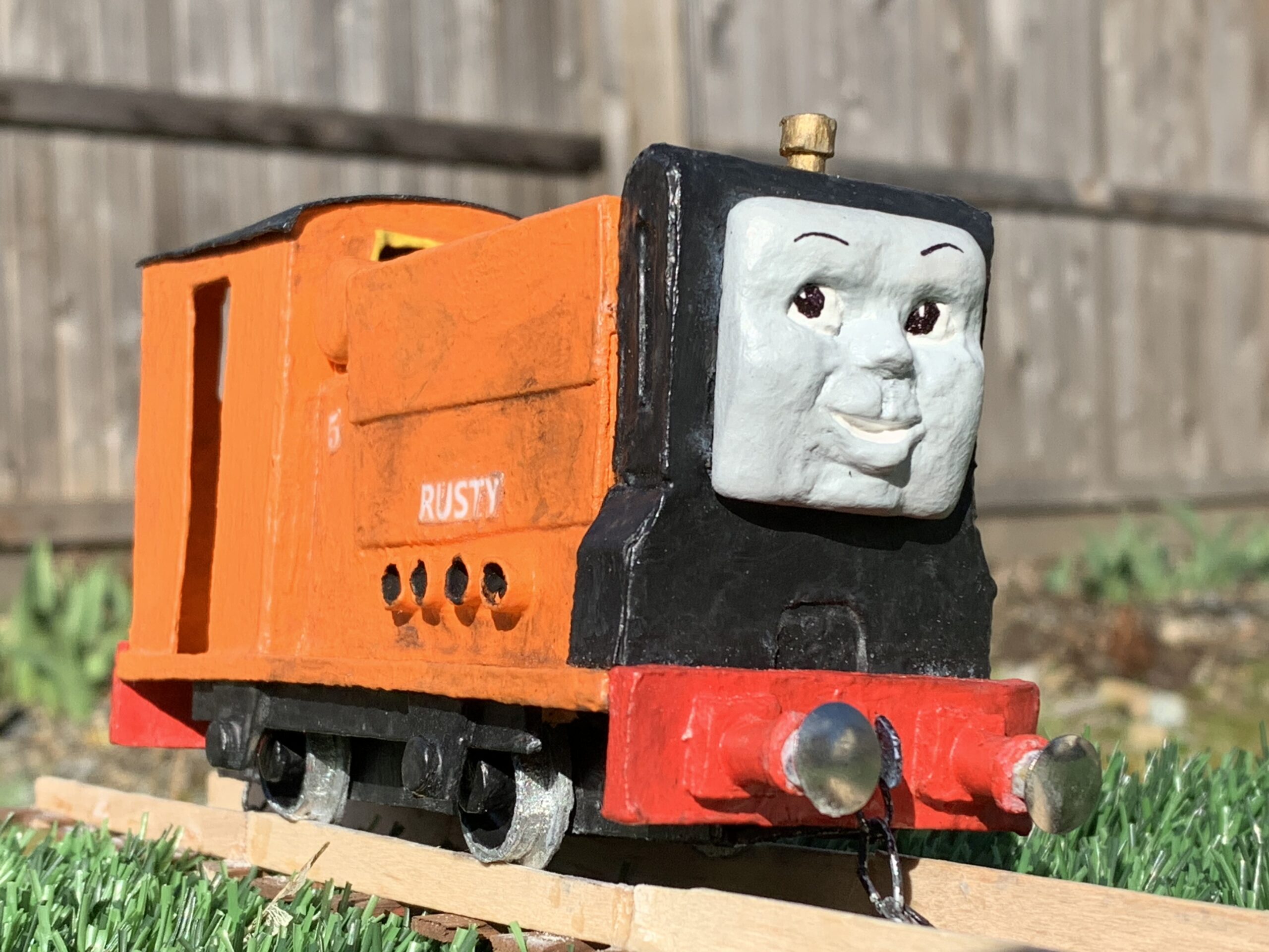 Here is this O scale model of the character, Rusty the Little Diesel. I made this model from mostly cardboard and wood, with the face being made from polymer clay. Below is a build reel showing how I made it: