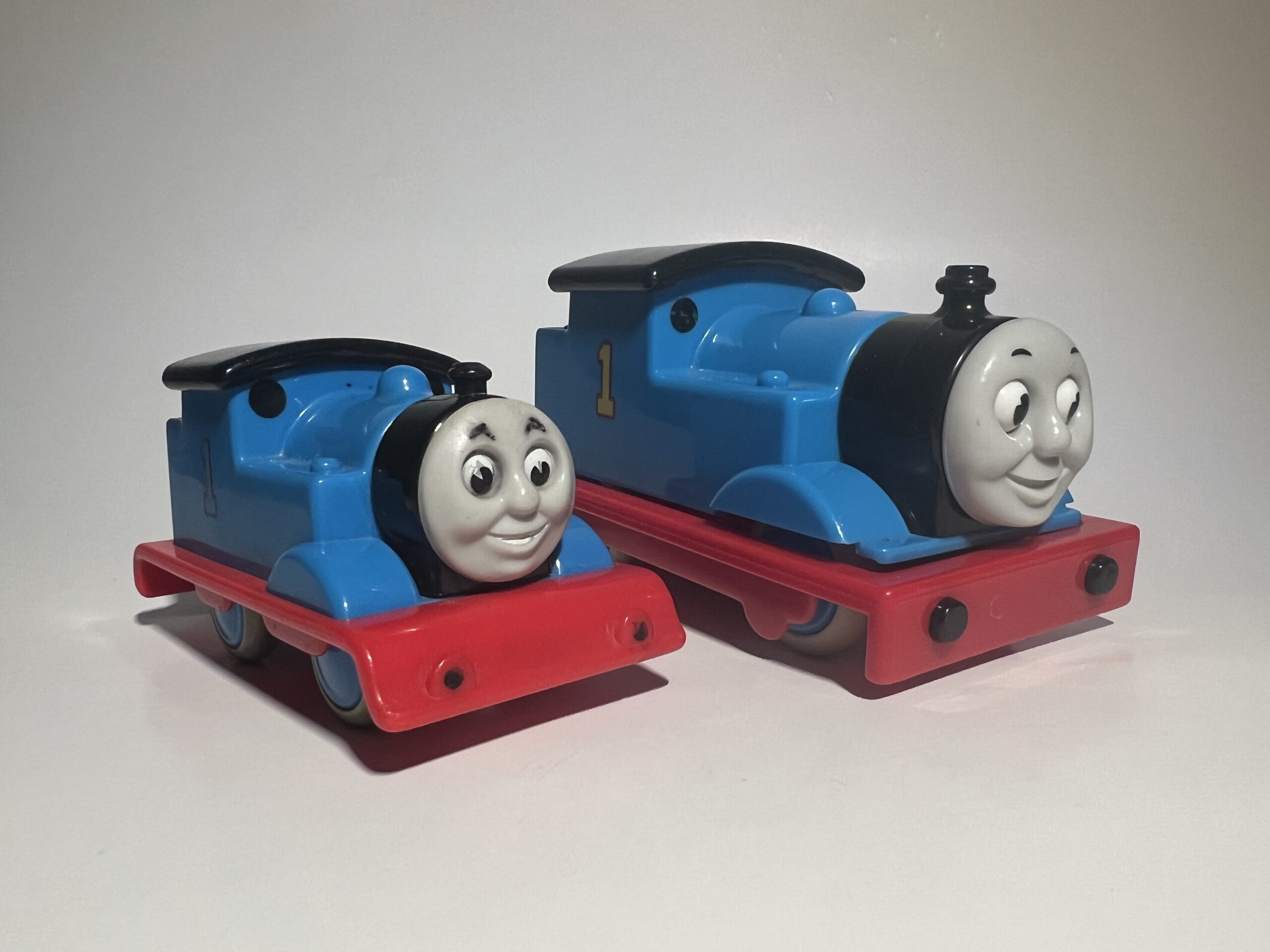 The "My First Thomas" range came in two scales; the small one is regular, and large one is a talking version with a moving eye mechanism. Previously, Golden Bear's products were distributed in other countries such as North America and Japan by the company TOMY; these distributions seem to have ceased around 1999 and 2006 respectively, and items made around that time up until 2009 were subsequently exclusively distributed in European countries, making them somewhat elusive anywhere else, including the "Crash n Bang" Thomas, which was released in 2008.